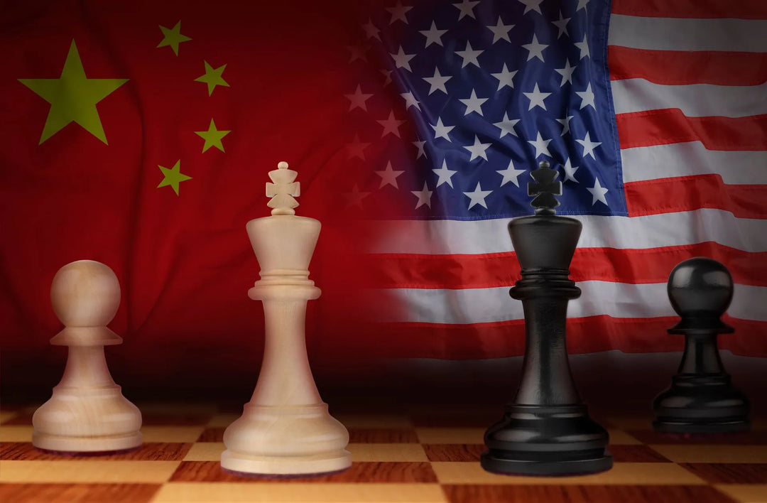 A chess board with chinese and american flags in the background.